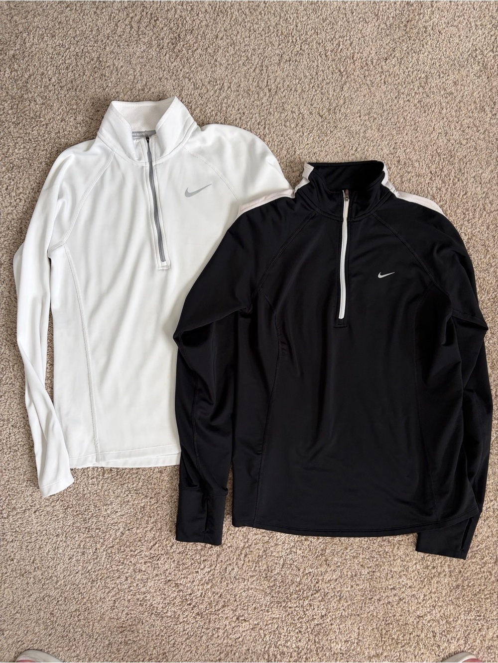 Two Nike Running Black and White Half-Zip Performance pullovers